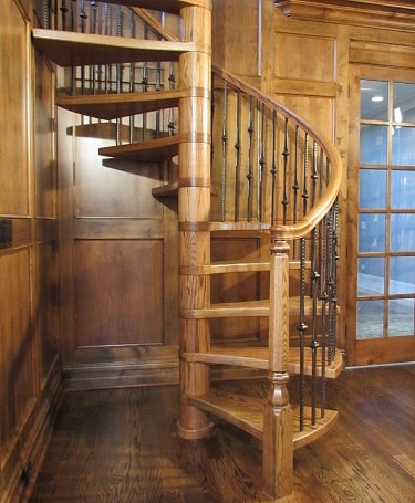 Oak spiral stair with metal balusters